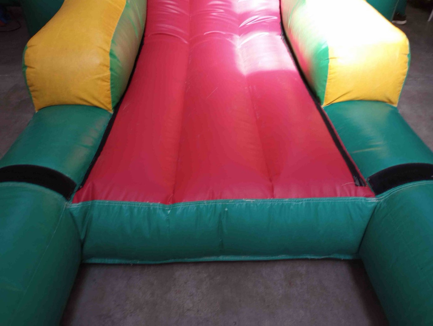 Rebuilt red slide bed inside a combo bouncer