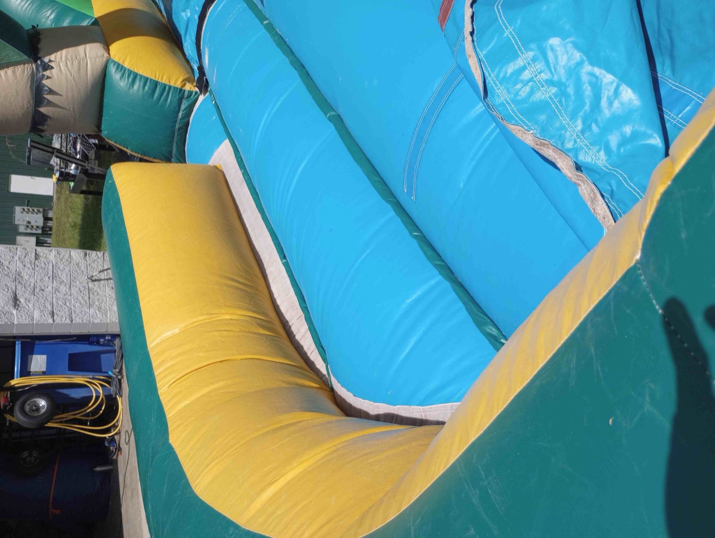 Repaired blue and yellow slide section